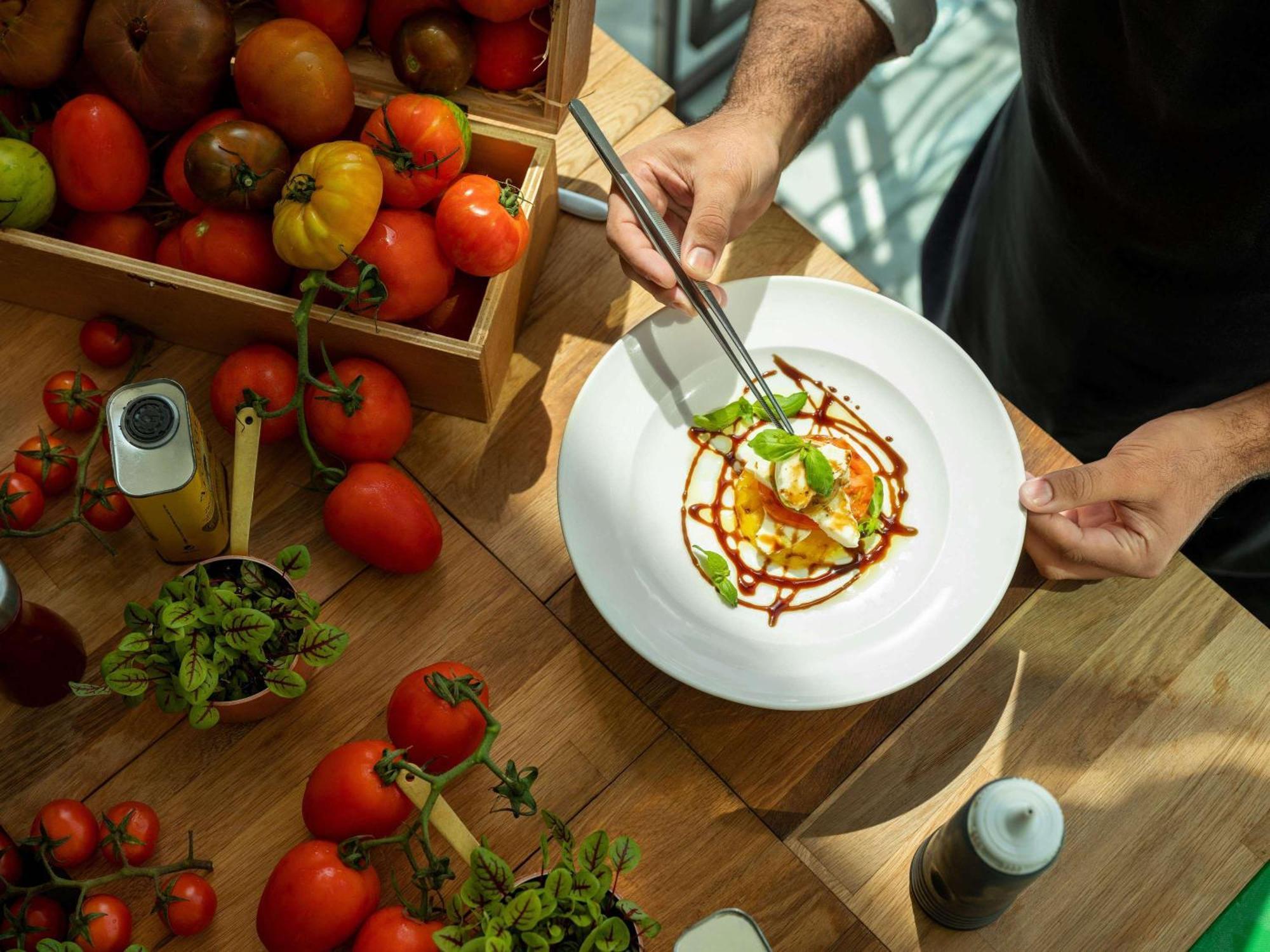 Fairmont Bab Al Bahr Hotel Abu Dhabi Exterior photo A chef finishing a plate of food